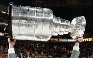 someone hoisting the Stanley Cup Trophy