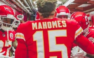 Patrick Mahomes talking to his team in the locker room