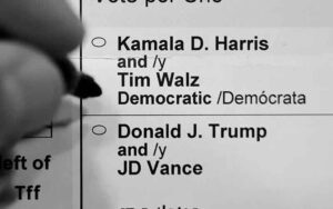 A voter about to decide between Harris and Trump on their ballot