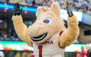 mascot for the Oklahoma Sooners throwing up a touchdown signal