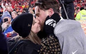 Travis Kelce and Taylor Swift kissing after the Super Bowl