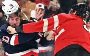 Team USA and Team Canada hockey teams fighting
