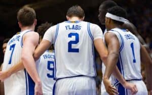members of Duke's basketball team huddling