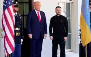Trump and Zelenskyy standing between US and Ukraine flags