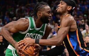 players for the Boston Celtics and Oklahoma City Thunder fighting for the ball