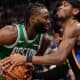 players for the Boston Celtics and Oklahoma City Thunder fighting for the ball