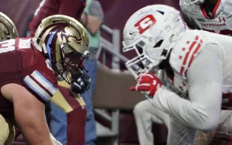 A D.C. Defenders and Michigan Panthers lineman on the line of scrimmage