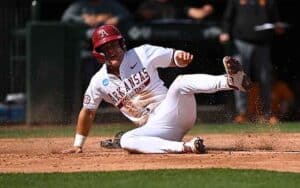 an Arkansas Baseball player sliding