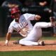 an Arkansas Baseball player sliding