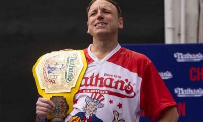 Joey Chestnut weawring a Hot Dog Eating Championship belt