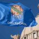 The Oklahoma flag flying in front of the state legislature