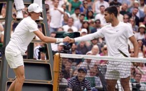 Janik Sinner and Carlos Alcaraz shaking hands after a match
