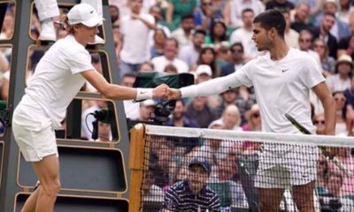 Janik Sinner and Carlos Alcaraz shaking hands after a match