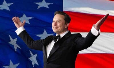 Elon Musk in a tuxedo in front of an Ameican Flag