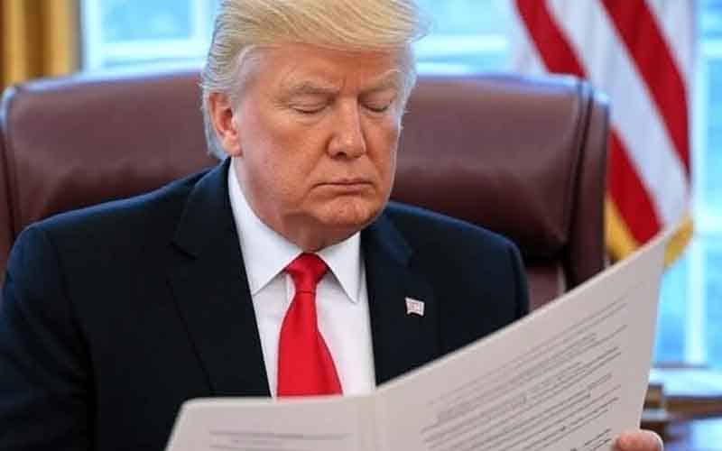 President Trump reading the Big Beautiful Bill in the Oval Office