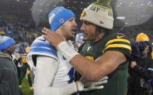 Jared Goff giving Jordan Love a hug after a Lions Packers game