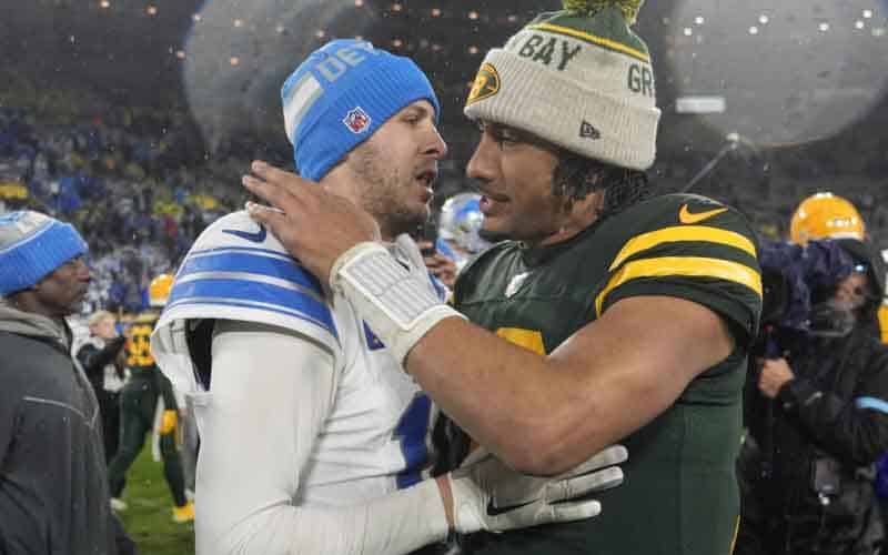Jared Goff giving Jordan Love a hug after a Lions Packers game