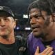 Lamar Jackson and Jim Harbaugh walking off the field together