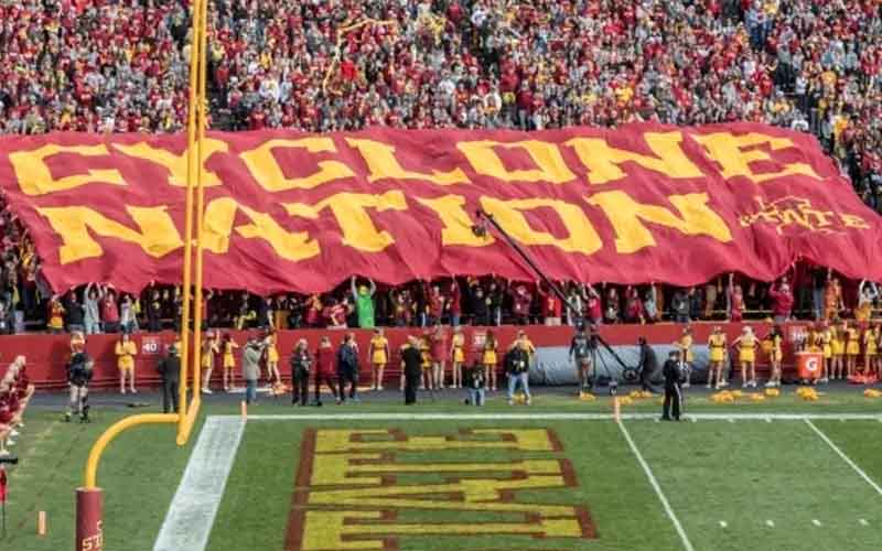 ISU fans holding up a Cycone Nation flag