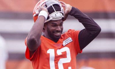 Shedeur Sanders taking off his helmet at Cleveland Browns practice