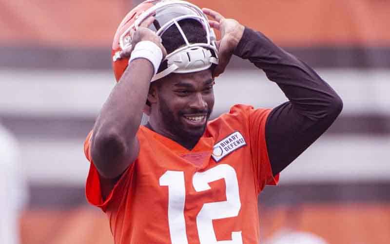 Shedeur Sanders taking off his helmet at Cleveland Browns practice