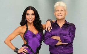 Corey Feldman and Jenna Johnson dressed in purple Dancing with the Stars costumes