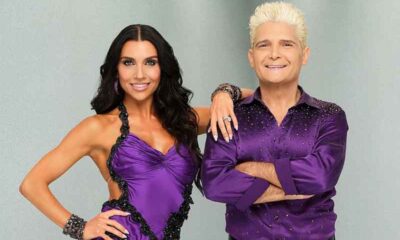 Corey Feldman and Jenna Johnson dressed in purple Dancing with the Stars costumes