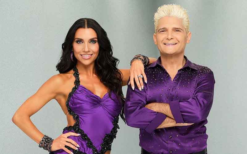 Corey Feldman and Jenna Johnson dressed in purple Dancing with the Stars costumes