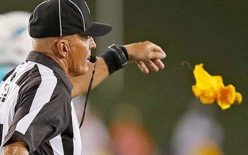 NFL ref throwing a flag