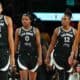 four members of the 2025 Las Vegas Aces walking with swagger