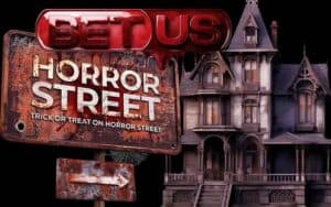 A Bloody BetUS logo above a horror street sign