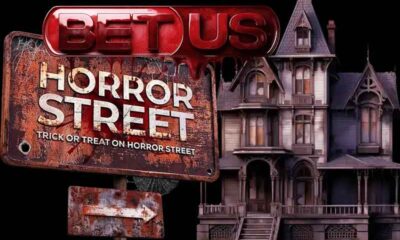A Bloody BetUS logo above a horror street sign
