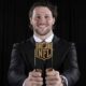 Josh Allen holding an NFL MVP Award