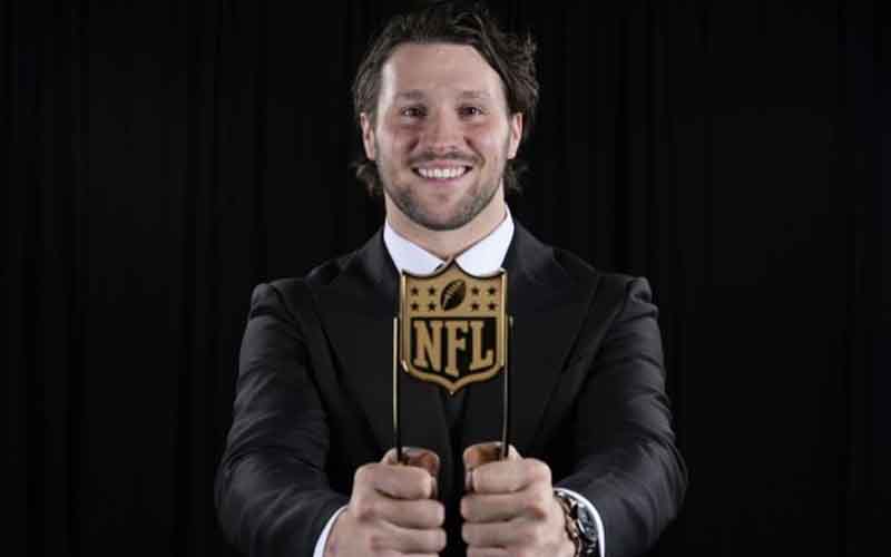 Josh Allen holding an NFL MVP Award