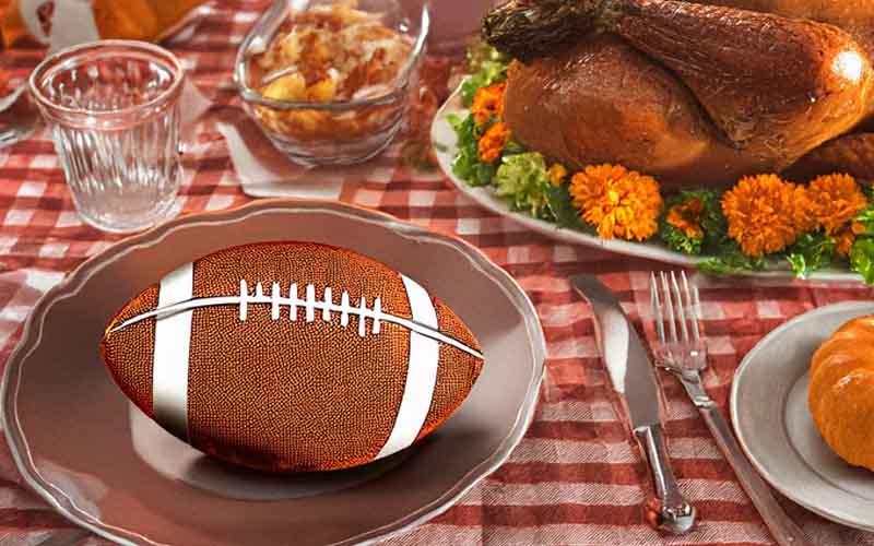 a football as part of a Thanksgiving table setting