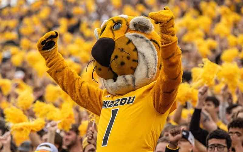 The University of Missouri's mascot Truman the Tiger cheering alongside fans