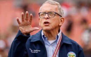 OH Governor Mike DeWine with his right palm facing camera