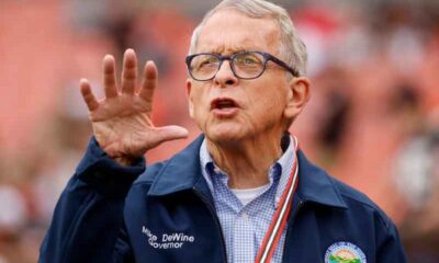 OH Governor Mike DeWine with his right palm facing camera