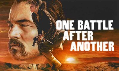 a poster for One Battle After Another featuring Leonardo DiCaprio