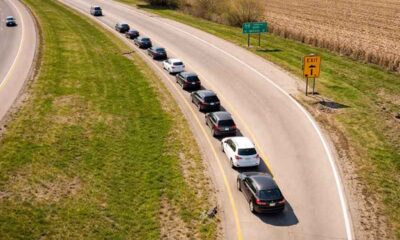 cars pulled off on the side of an interstate exit
