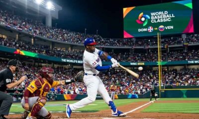 A player swinging at a pitch at the WBC