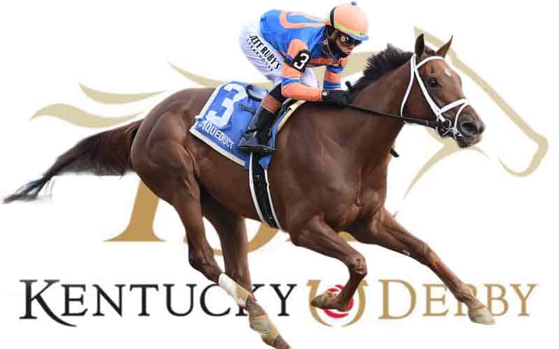 Thoroughbred horse and jockey racing at the Kentucky Derby, rider in blue and orange silks with a white bridle against Derby branding in the background.