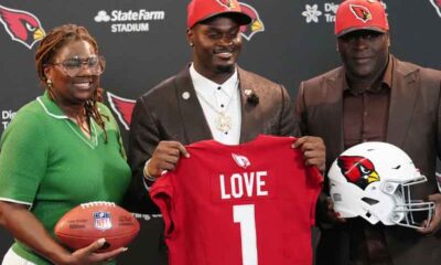 Jeremiyah Love and his parents after being drafted by the Cardinals