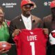 Jeremiyah Love and his parents after being drafted by the Cardinals