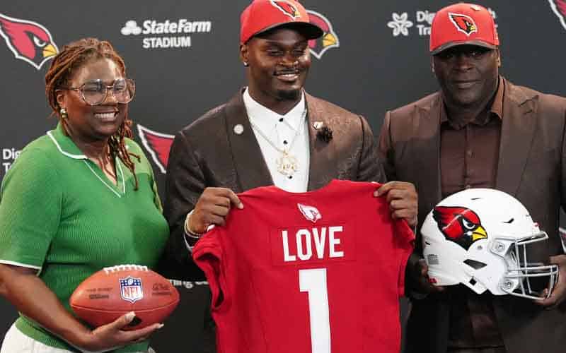 Jeremiyah Love and his parents after being drafted by the Cardinals