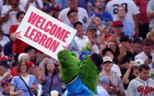 Phillie Phanatic holding up a Welcome LeBron sign