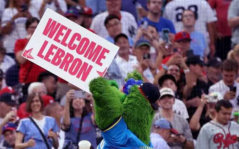 Phillie Phanatic holding up a Welcome LeBron sign