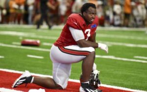 Rueben Bain Jr. of the Tampa Bay Buccaneers taking a knee
