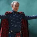 The Traitors host Alan Cumming spreading his arms