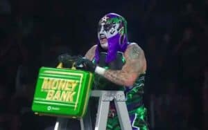 Penta claiming the Money In The Bank briefcase